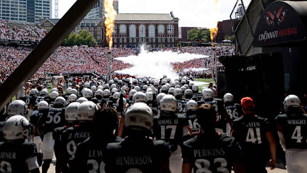 Cincinnati Bearcats prepare to run out onto the field before the NCAA football game between the Cincinnati Bearcats and the Eastern Kentucky Colonels at Nippert Stadium in Cincinnati on Saturday, Sept. 2, 2023.